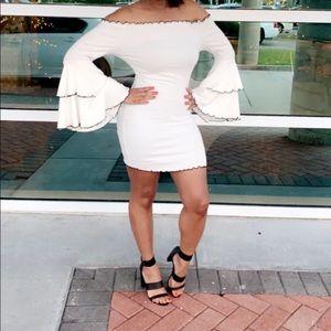 Off the shoulder, white with black trim dress